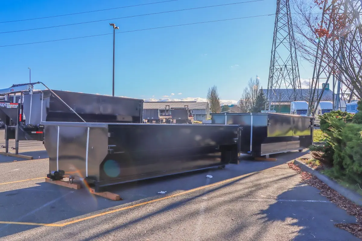 Roll-off dumpster ready for waste disposal at job site for 2 Yard Dumpster Rental in Gladstone